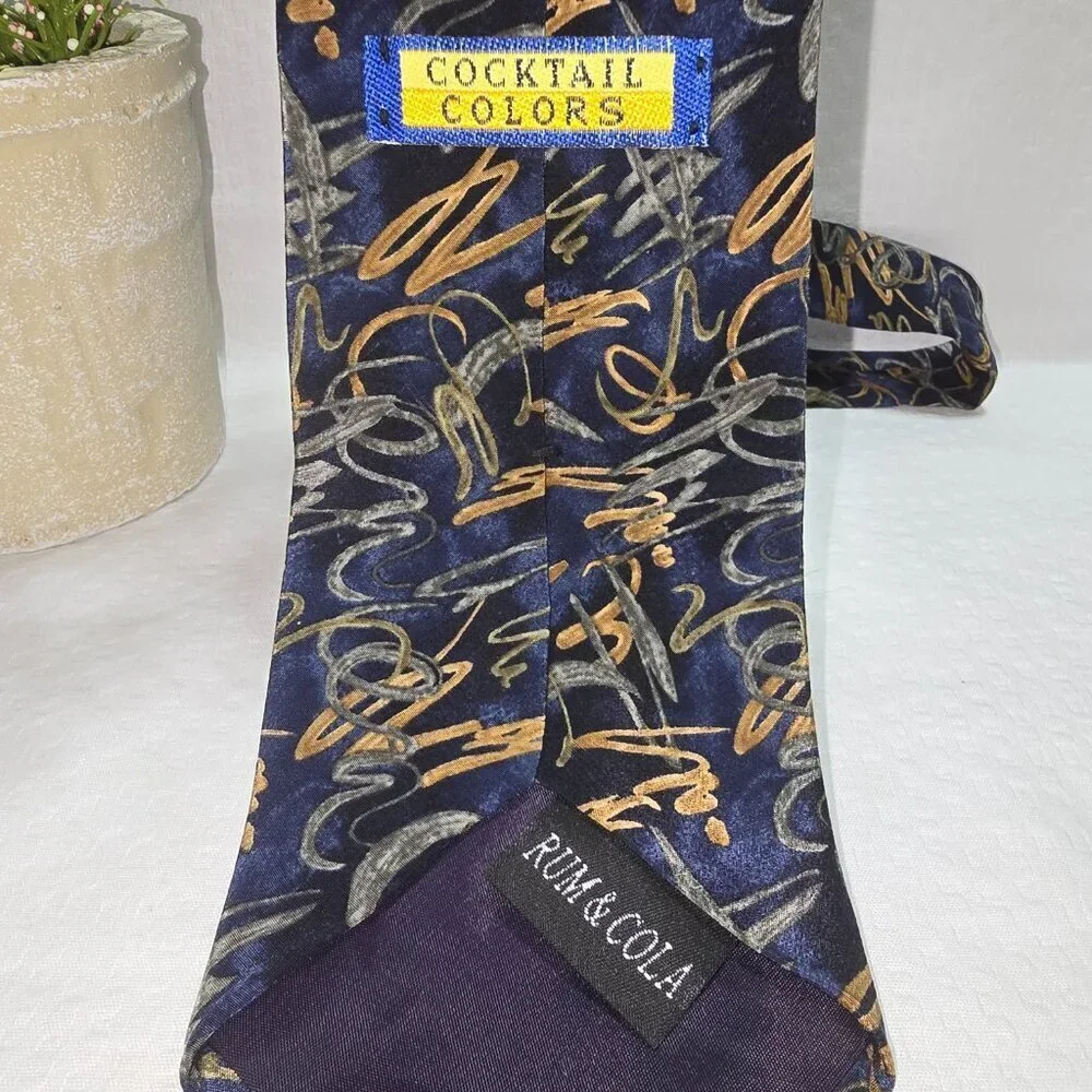COCKTAIL COLORS RUM AND COLA TIE SILK NAVY WITH GOLD GREEN SWIRL DESIGN EUC